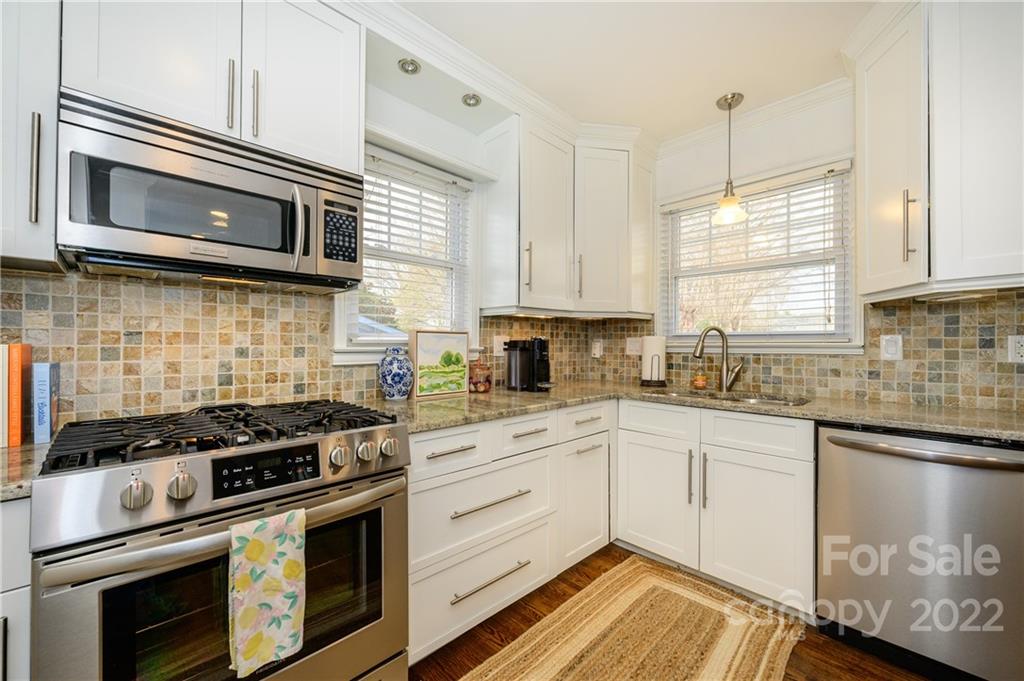 332 Marsh Road Charlotte, NC 28209 - Photo 16 of 37 a kitchen with cabinets stainless steel appliances and a sink