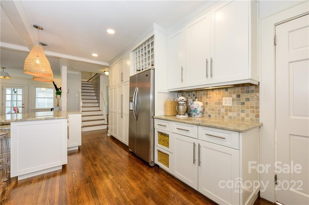 332 Marsh Road Charlotte, NC 28209 - Photo 17 of 37 a kitchen with stainless steel appliances granite countertop a refrigerator and a stove top oven