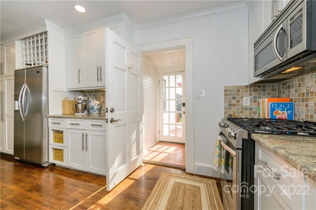 332 Marsh Road Charlotte, NC 28209 - Photo 18 of 37 a kitchen with stainless steel appliances granite countertop a stove a refrigerator and a stove