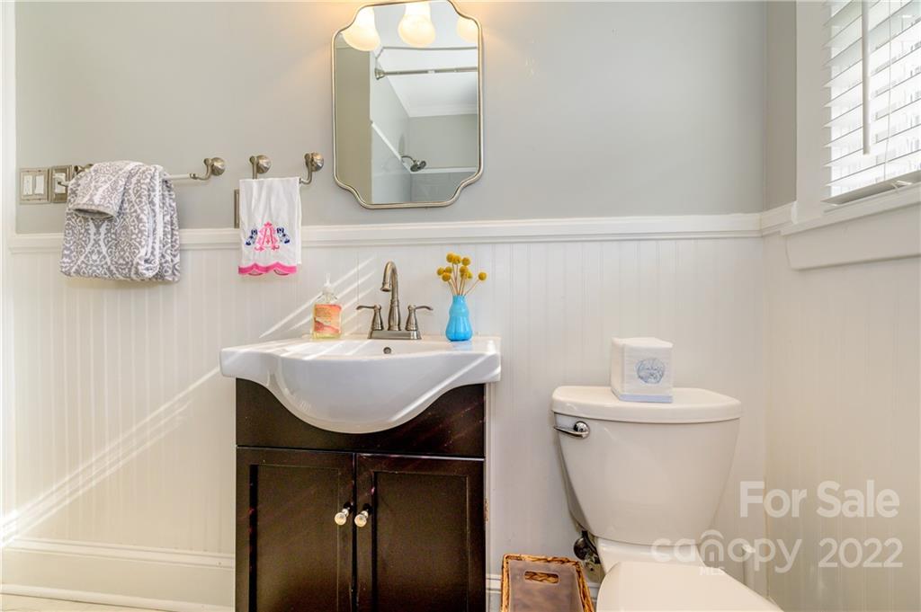 332 Marsh Road Charlotte, NC 28209 - Photo 22 of 37 a bathroom with a sink vanity mirror and toilet