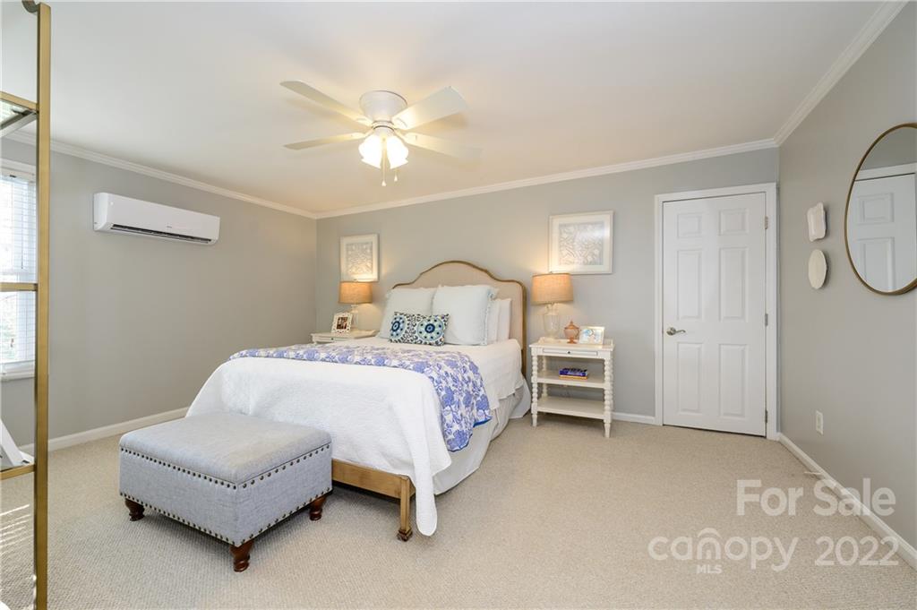 332 Marsh Road Charlotte, NC 28209 - Photo 27 of 37 a bedroom with a bed mirror and a window