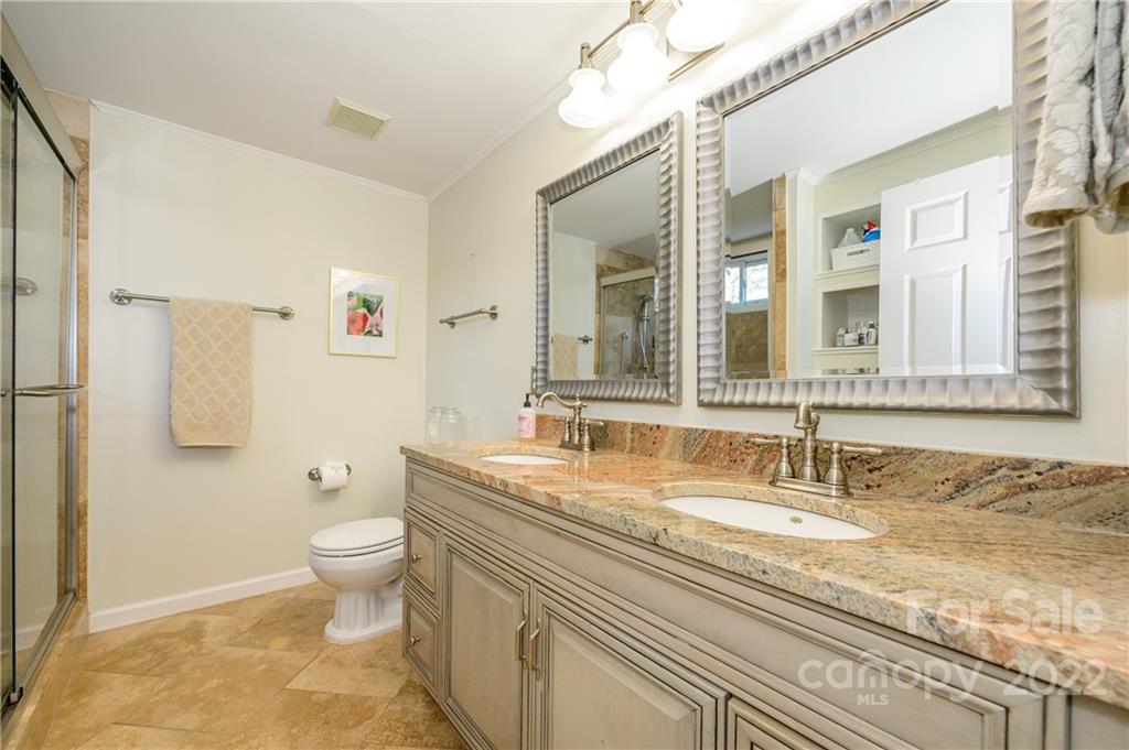 332 Marsh Road Charlotte, NC 28209 - Photo 30 of 37 a bathroom with a granite countertop sink and a mirror