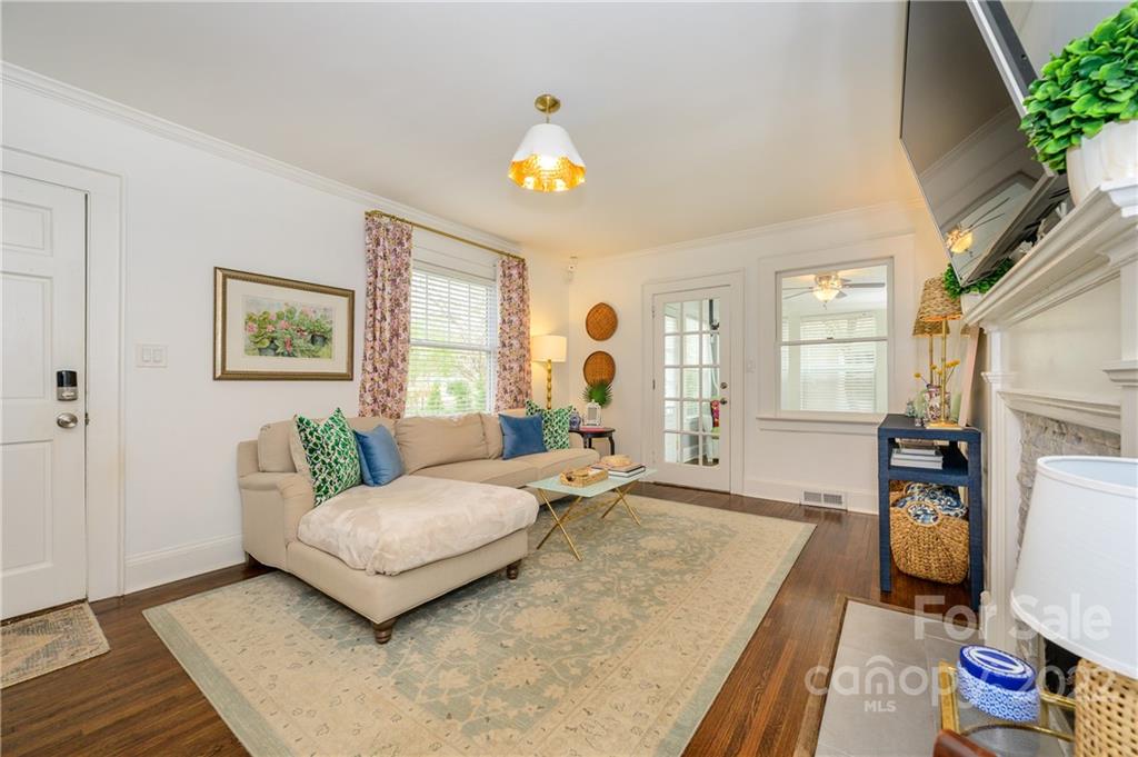 332 Marsh Road Charlotte, NC 28209 - Photo 4 of 37 a spacious bedroom with a bed and a couch