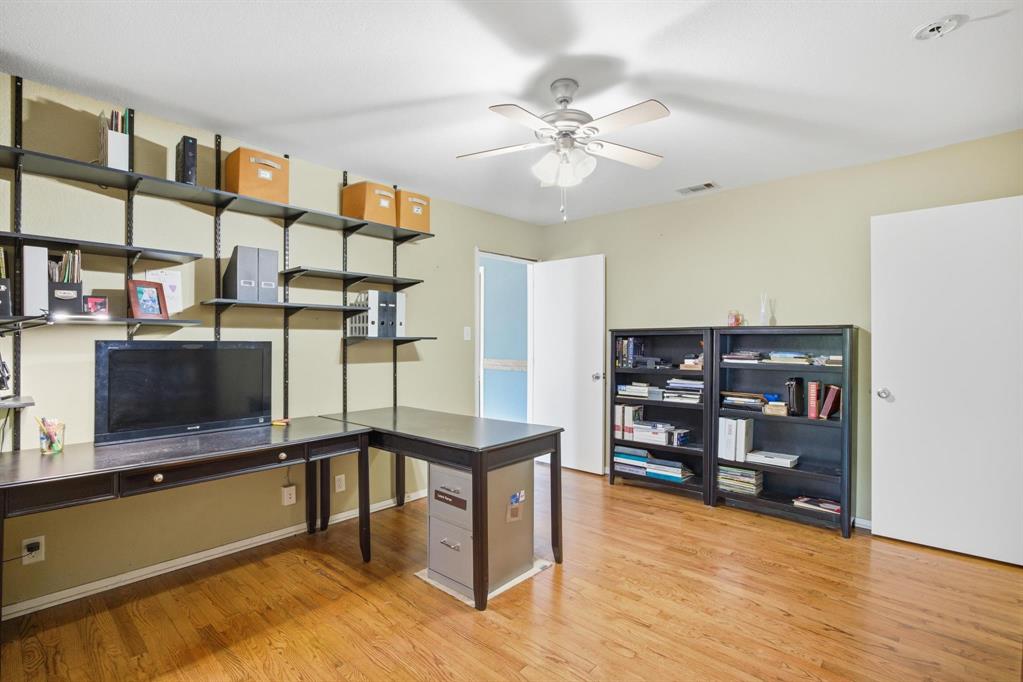 1004 Usher Street Benbrook, TX 76126 - Photo 16 of 25 a view of a living room with furniture and wooden floor