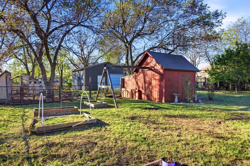 1004 Usher Street Benbrook, TX 76126 - Photo 20 of 25 a view of a house with backyard and sitting area