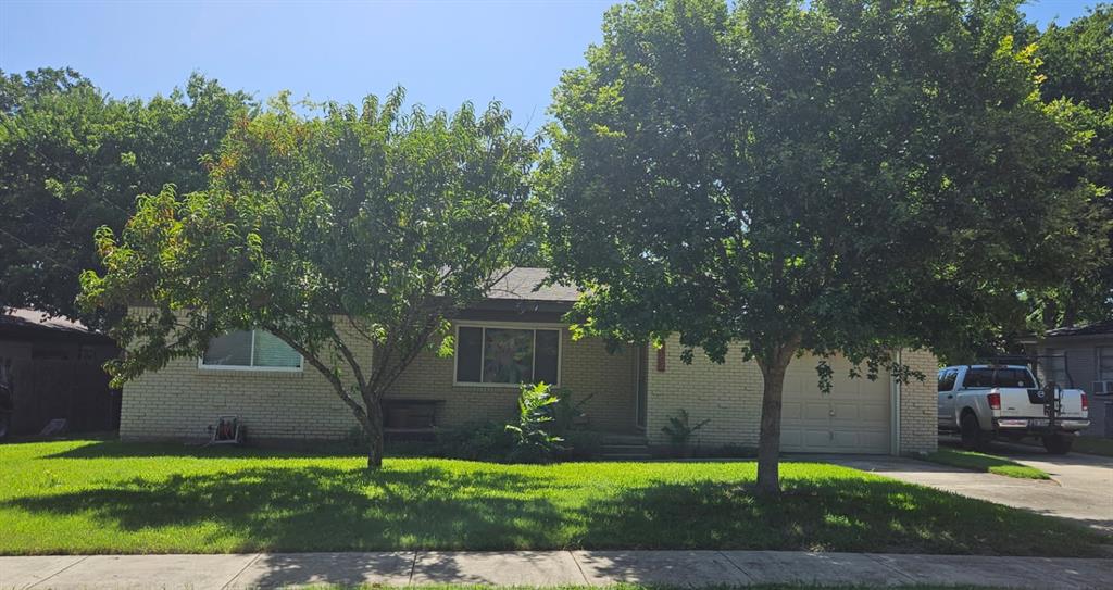 1004 Usher Street Benbrook, TX 76126 - Photo 24 of 25 a front view of a house with a yard and tree