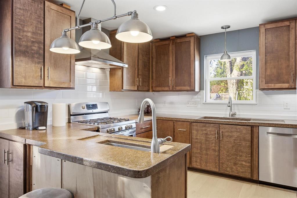 1004 Usher Street Benbrook, TX 76126 - Photo 5 of 25 a kitchen with a sink cabinets and window