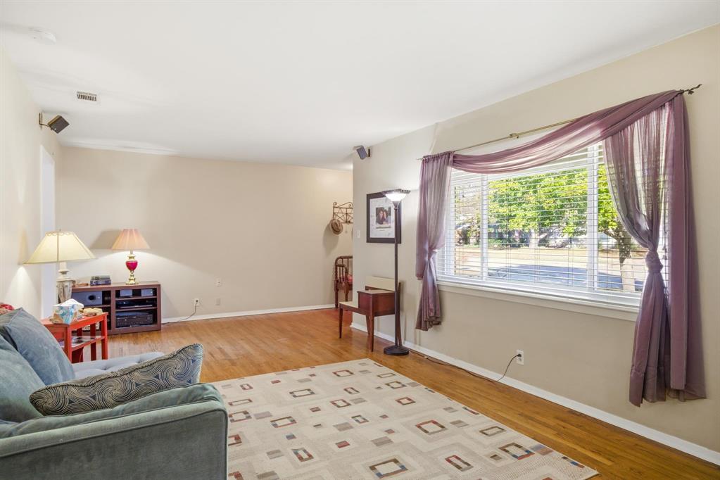 1004 Usher Street Benbrook, TX 76126 - Photo 7 of 25 a living room with furniture and a window