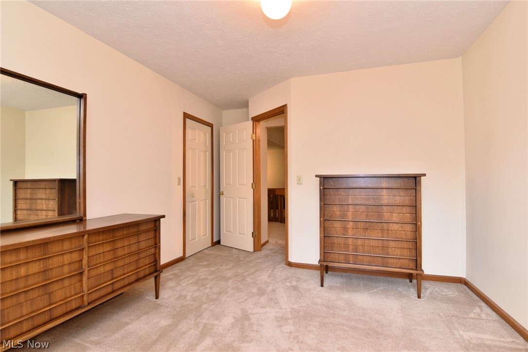 7655 Bellflower Road Mentor, OH 44060 - Photo 21 of 28 Carpeted bedroom with a textured ceiling