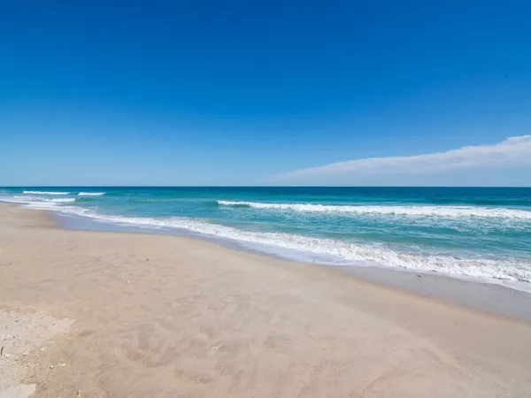 a view of an ocean and a yard