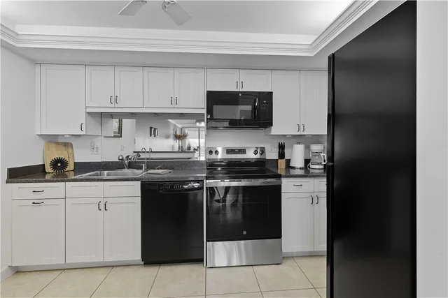 a kitchen with cabinets and stainless steel appliances