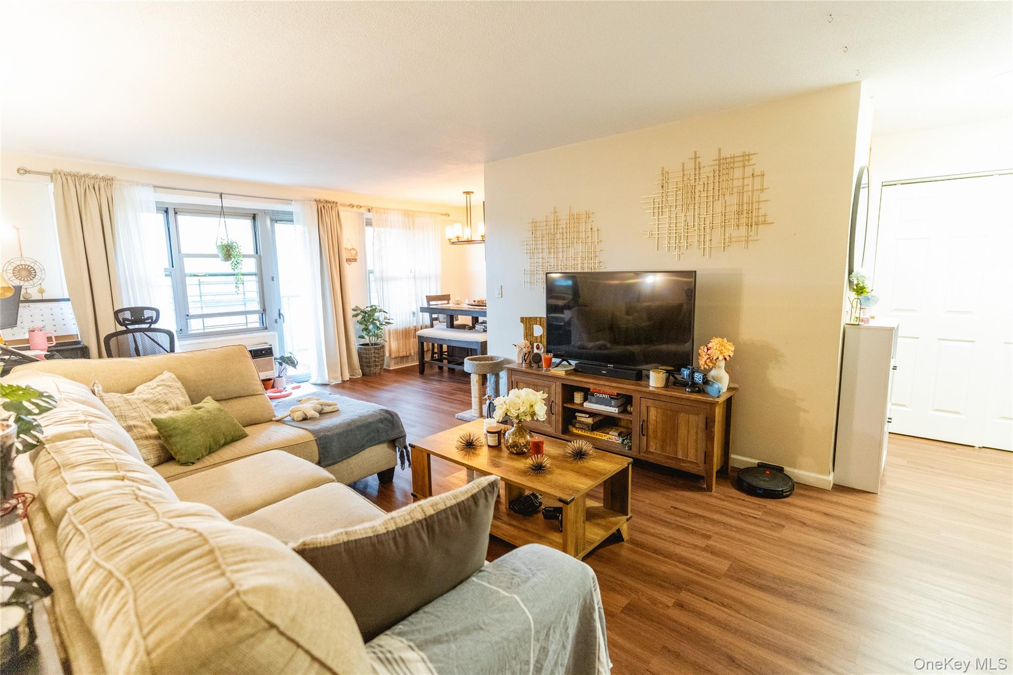 3410 De Reimer Avenue, Unit 7F Bronx, NY 10475 - Photo 3 of 23 a living room with furniture and a flat screen tv