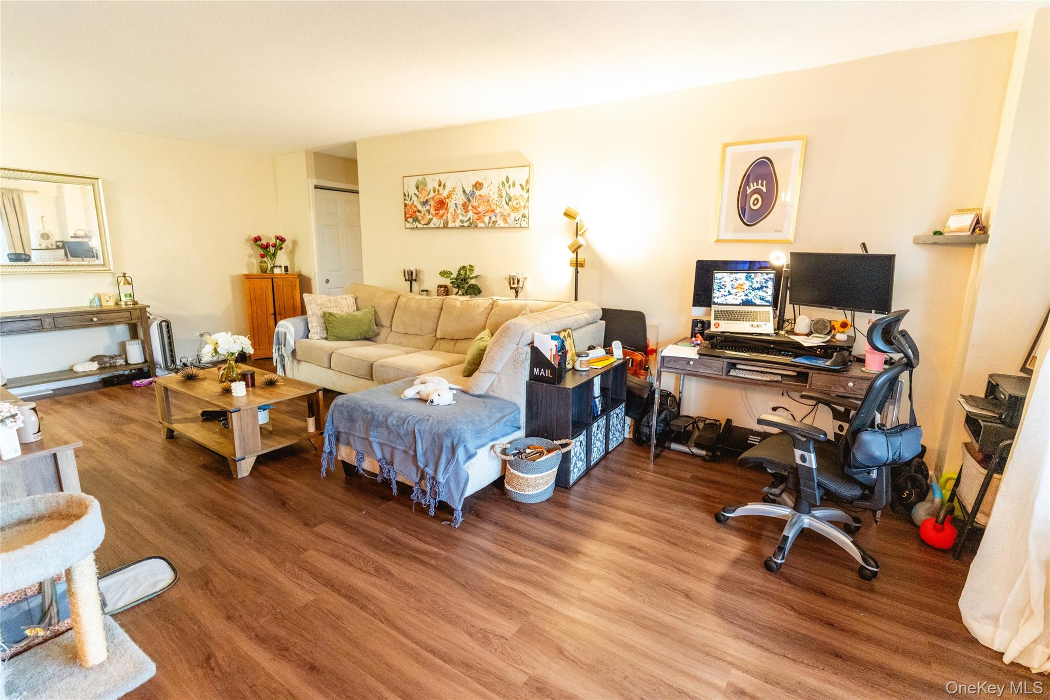 3410 De Reimer Avenue, Unit 7F Bronx, NY 10475 - Photo 4 of 23 a living room with furniture and a flat screen tv