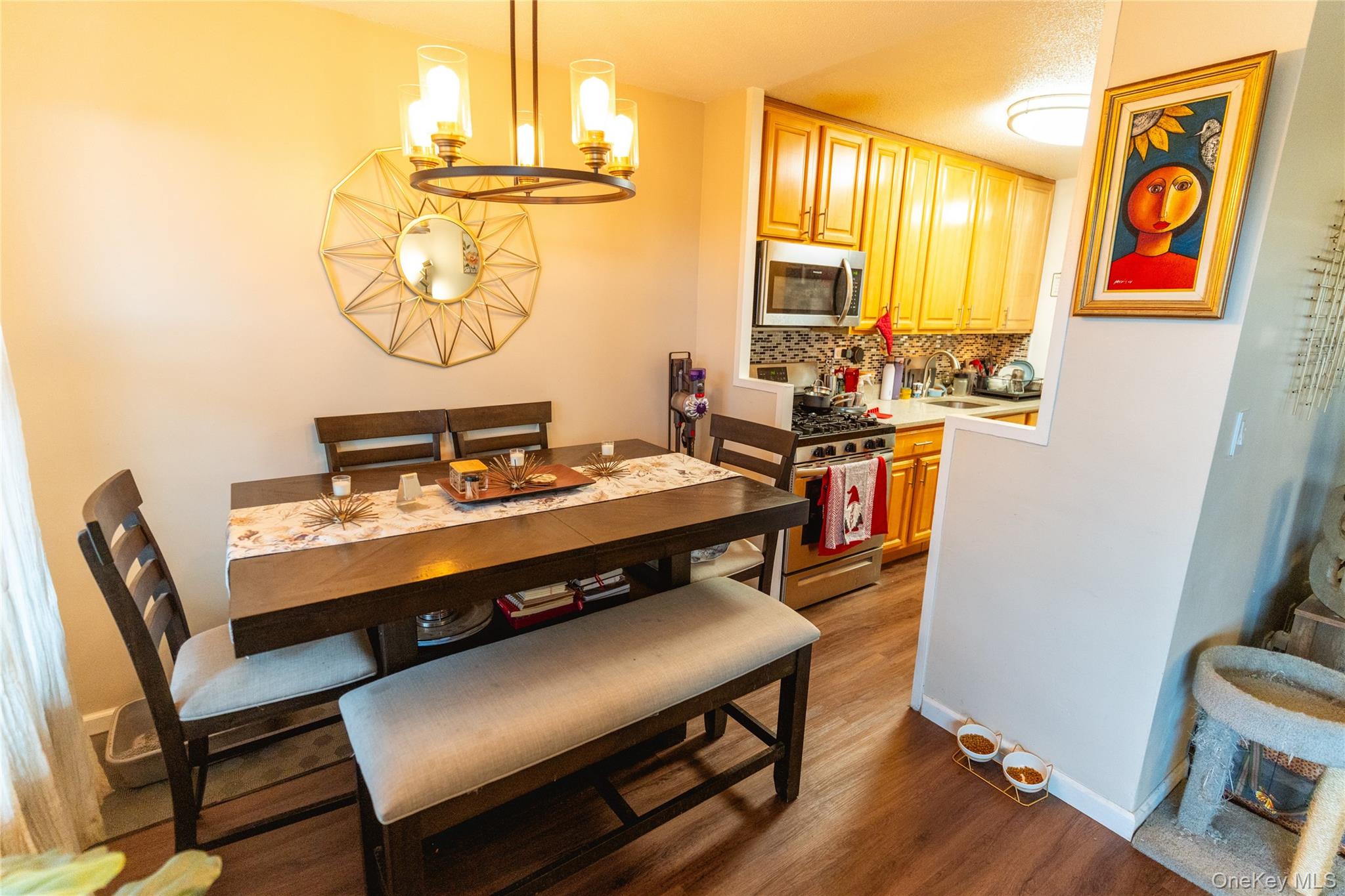 3410 De Reimer Avenue, Unit 7F Bronx, NY 10475 - Photo 5 of 23 a room with a table chairs and a workspace