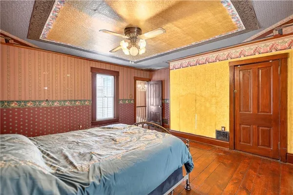 a bathroom with a sink a toilet and shower curtain