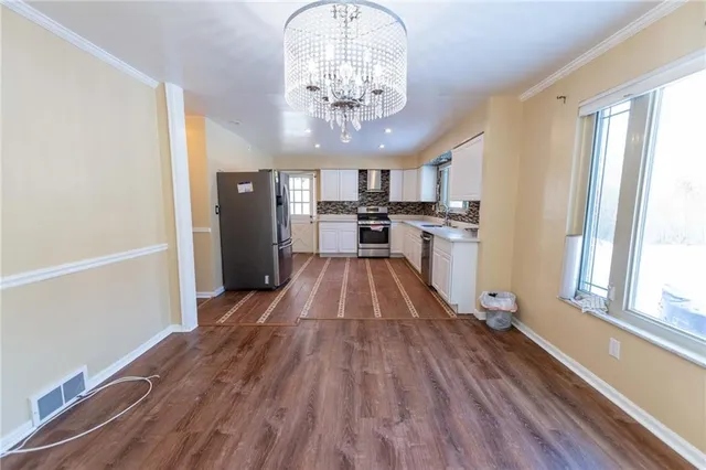 a view of a kitchen from the hallway