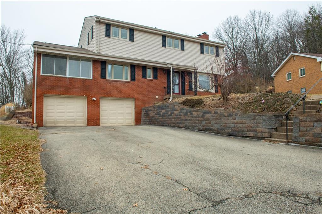 528 Wimer Circle Pittsburgh, PA 15237 - Photo 2 of 48 a front view of a house with a garage