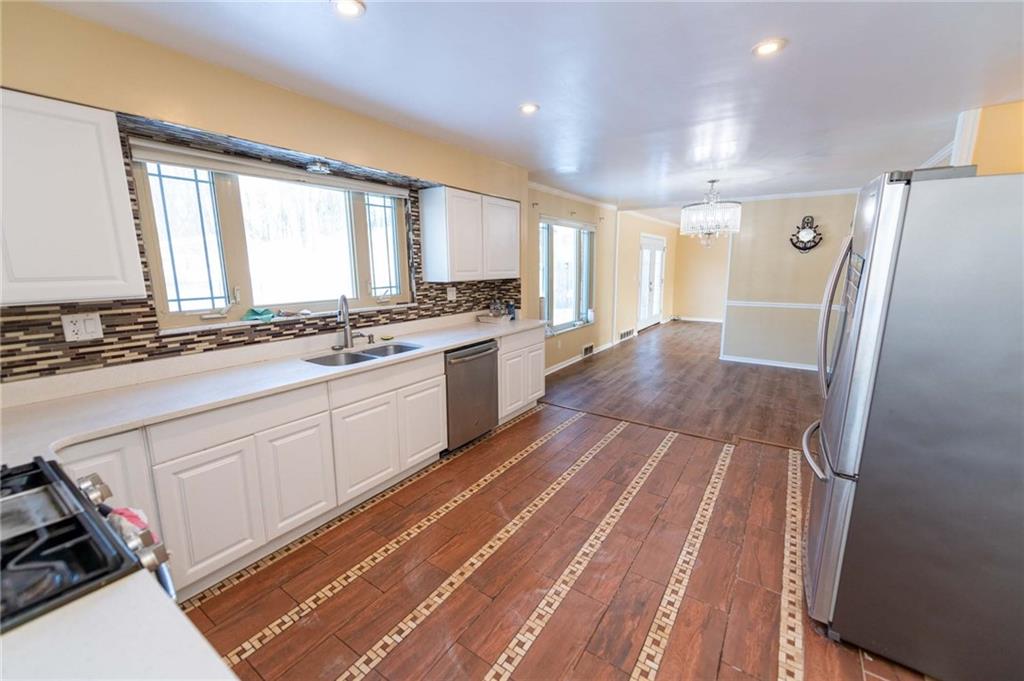 528 Wimer Circle Pittsburgh, PA 15237 - Photo 21 of 48 a large kitchen with a stove a sink dishwasher a refrigerator and cabinets