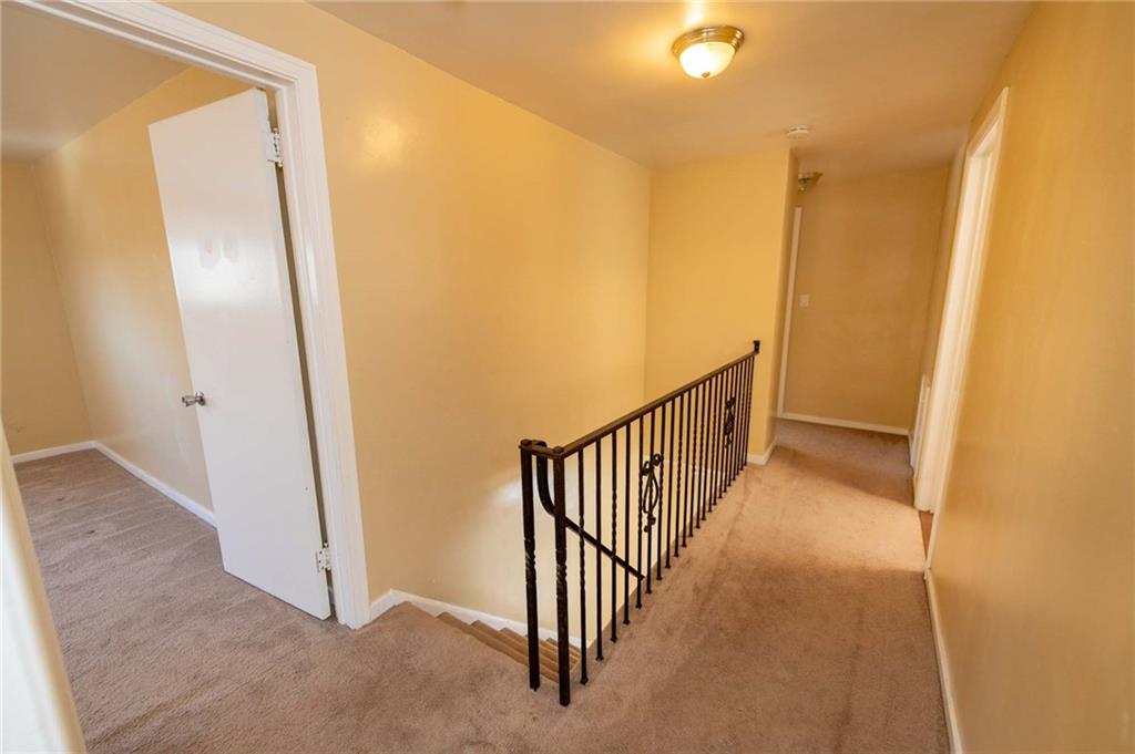 528 Wimer Circle Pittsburgh, PA 15237 - Photo 24 of 48 a view of a hallway with wooden floor and staircase