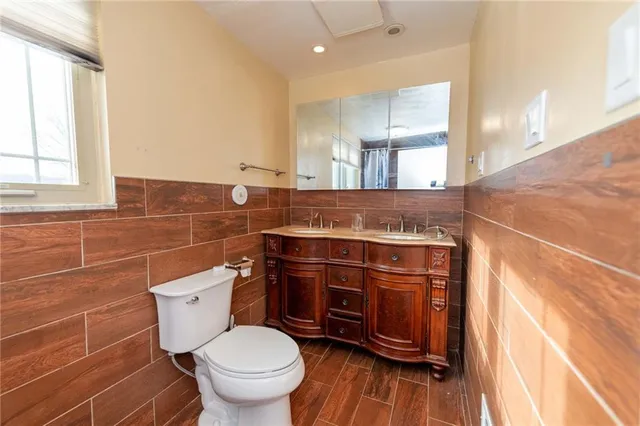 a bathroom with a bathtub a toilet and a shower