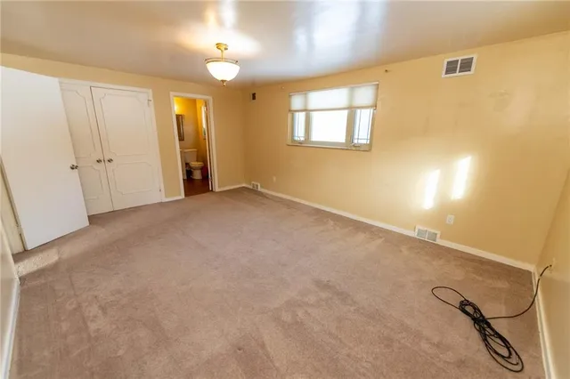 a bathroom with a toilet sink and shower
