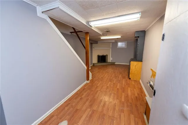 a view of a room with wooden floor and staircase