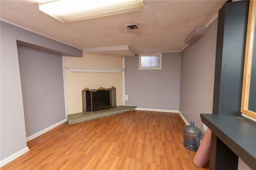 528 Wimer Circle Pittsburgh, PA 15237 - Photo 42 of 48 a view of empty room with wooden floor and fireplace