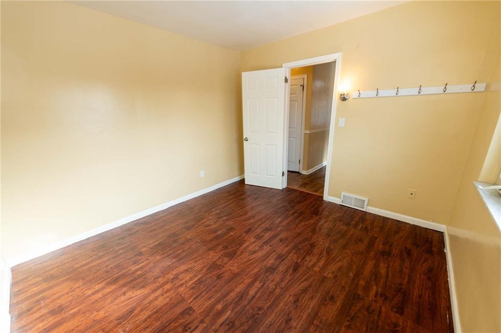 528 Wimer Circle Pittsburgh, PA 15237 - Photo 6 of 48 a view of an empty room with wooden floor and a window