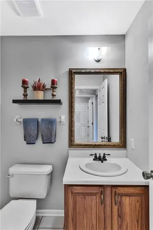 a view of a hallway with wooden floor and entryway