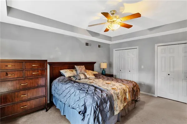 a bedroom with furniture and a window
