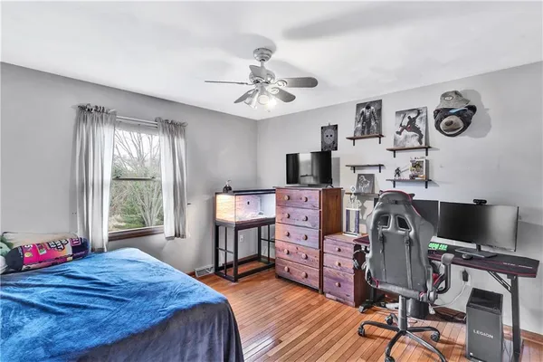 a bathroom with a toilet a sink and a mirror