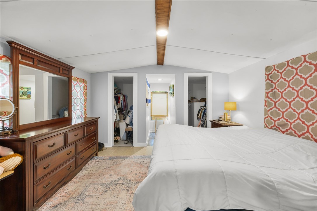 217 Old River Road Pelzer, SC 29669 - Photo 12 of 30 This primary bedroom features a vaulted ceiling, providing an open and airy feel to the space.