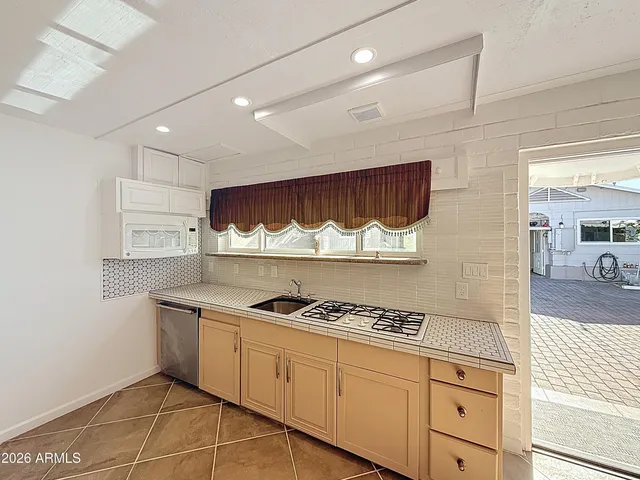 a bedroom with a bed and a ceiling fan