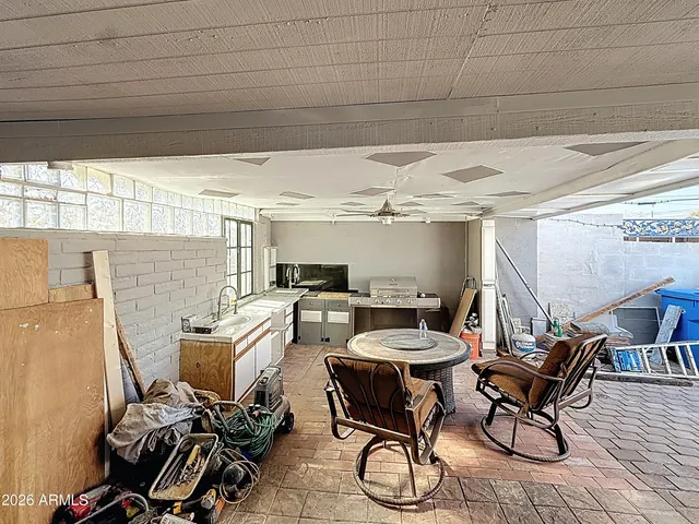a bed room with furniture and a flat screen tv