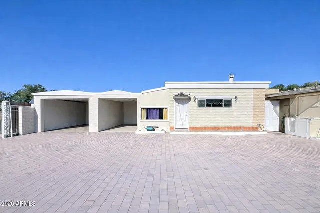 a view of a livingroom with a chandelier furniture and a chandelier