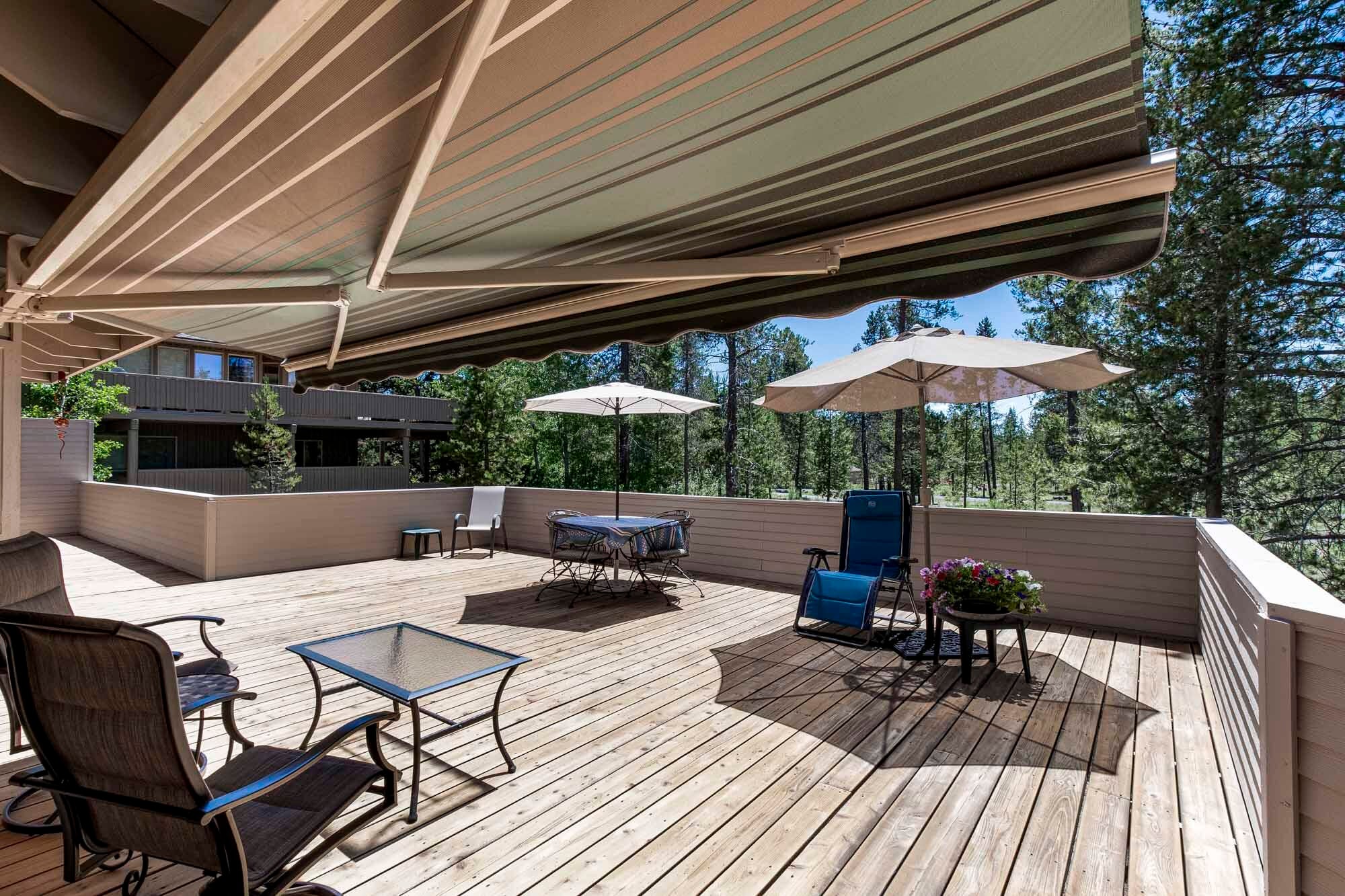 18187 Oregon Loop Sunriver, OR 97707 - Photo 16 of 37 A mechanical awning rolls out to cover even more of the rear deck space.