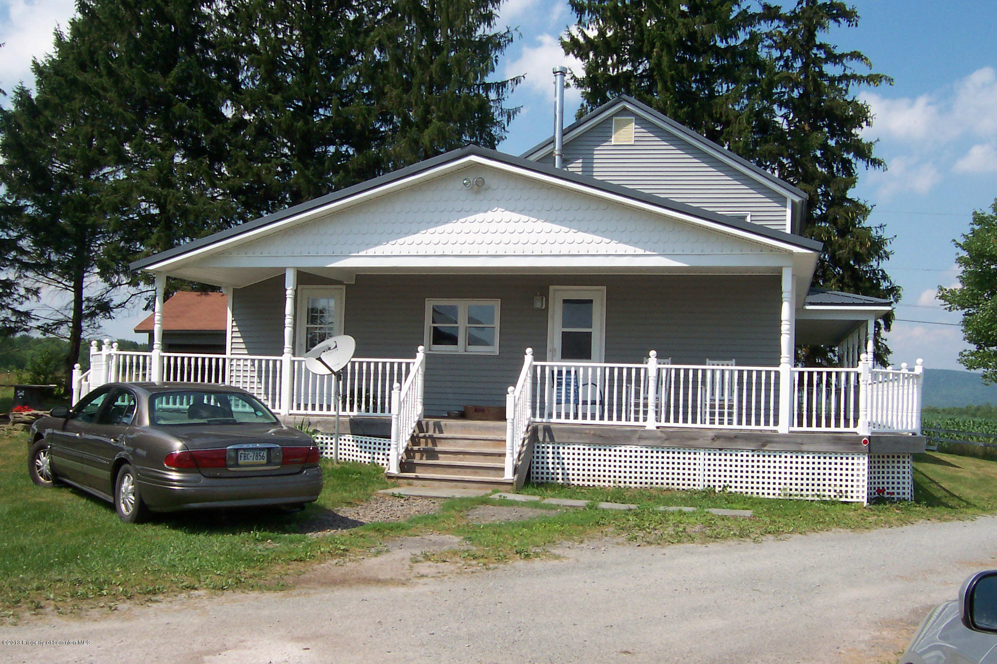 4477 State Rte 2023 Union Dale, PA 18470 - Photo 20 of 28 a front view of a house with a garden and plants