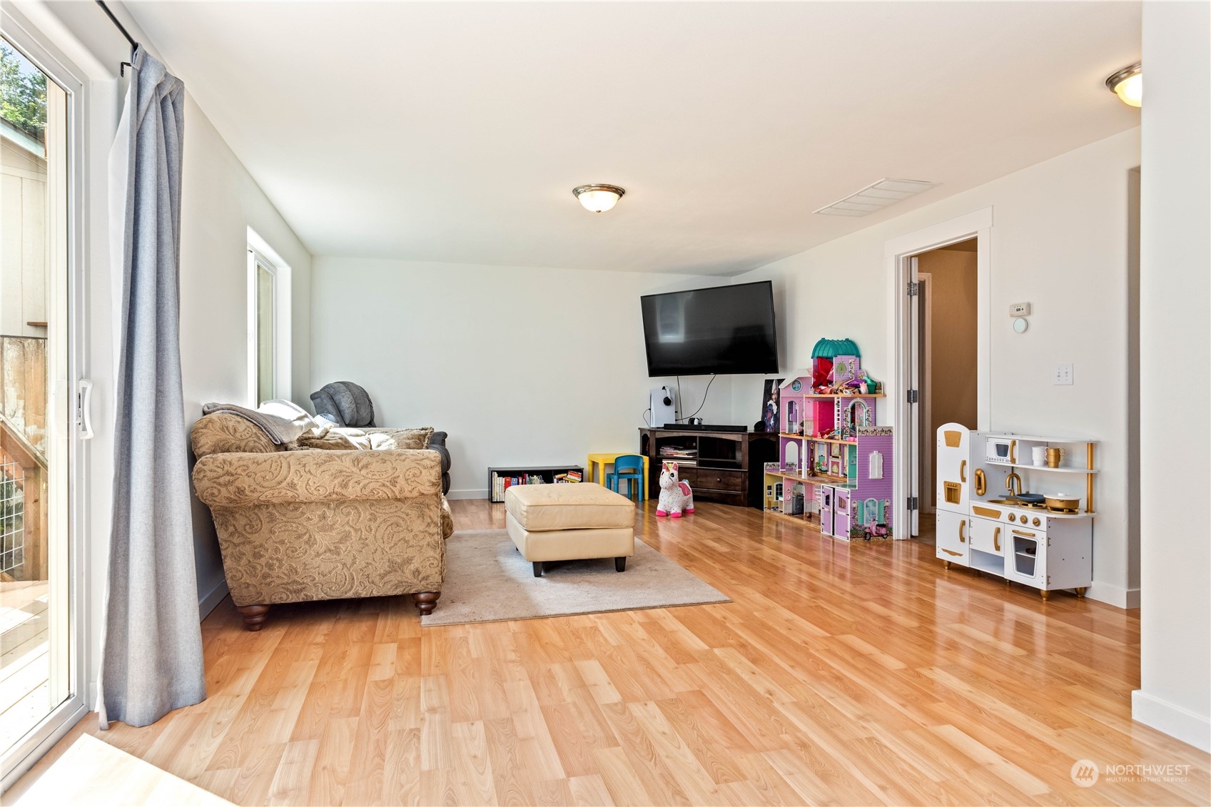 3083 Ash Way Sedro-Woolley, WA 98284 - Photo 12 of 36 a living room with furniture and a flat screen tv