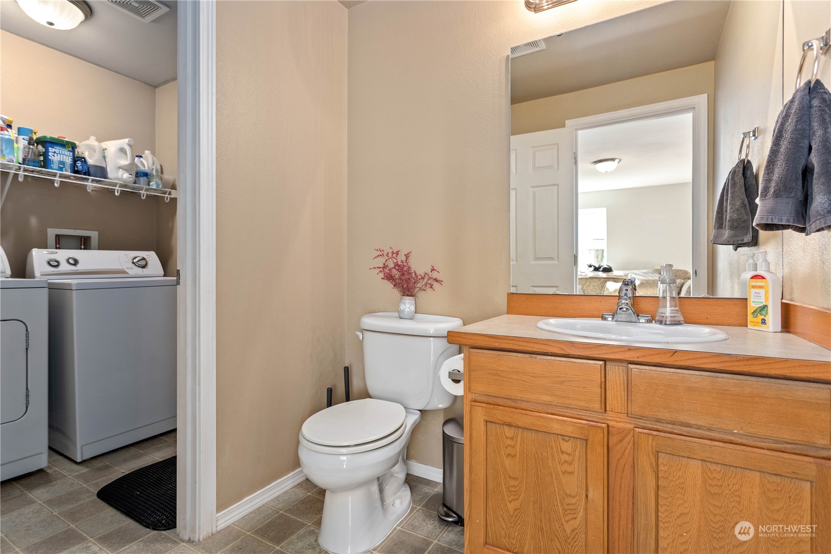 3083 Ash Way Sedro-Woolley, WA 98284 - Photo 16 of 36 a bathroom with a sink a toilet and mirror