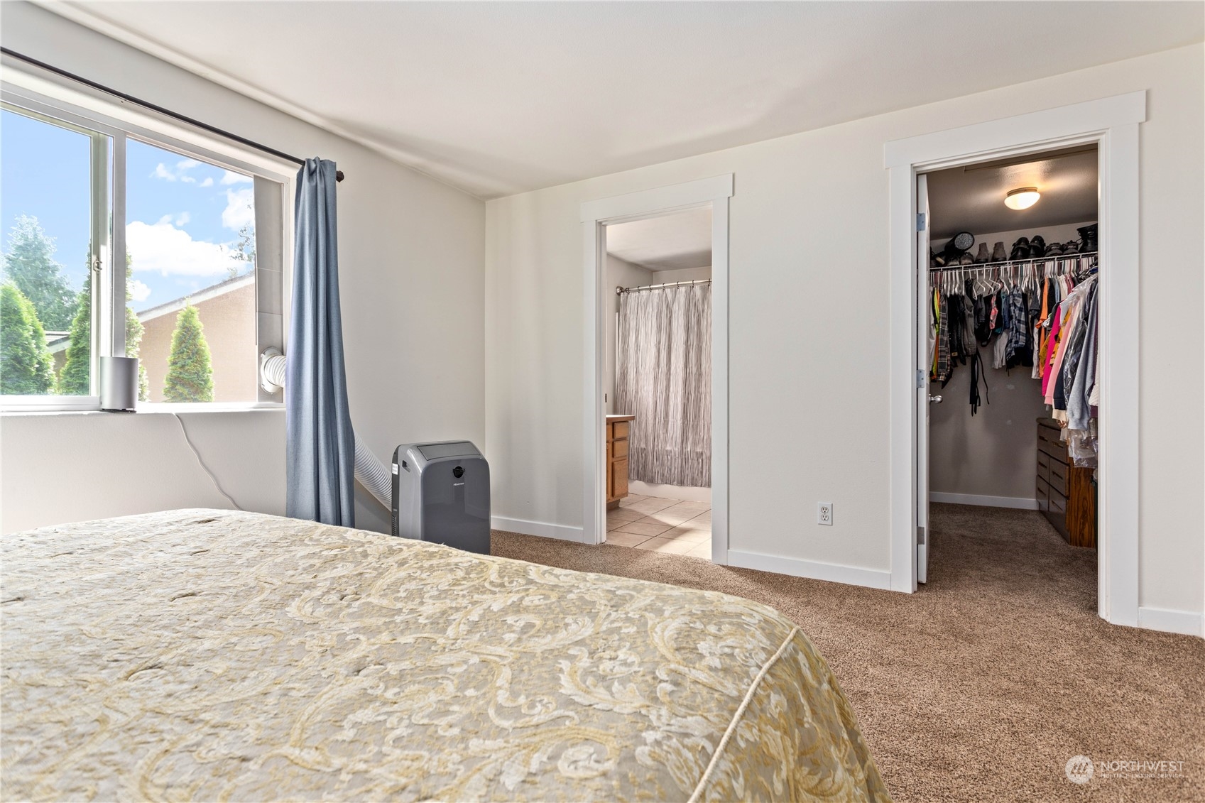 3083 Ash Way Sedro-Woolley, WA 98284 - Photo 19 of 36 a bedroom with a bed and a large window