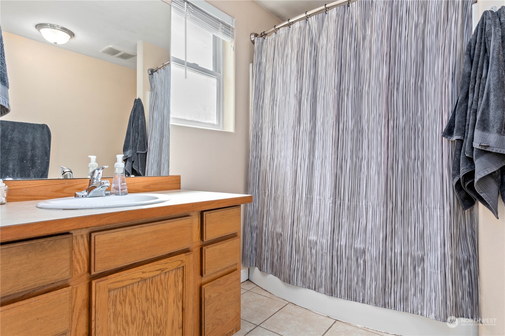 3083 Ash Way Sedro-Woolley, WA 98284 - Photo 20 of 36 a bathroom with a sink a vanity and a mirror