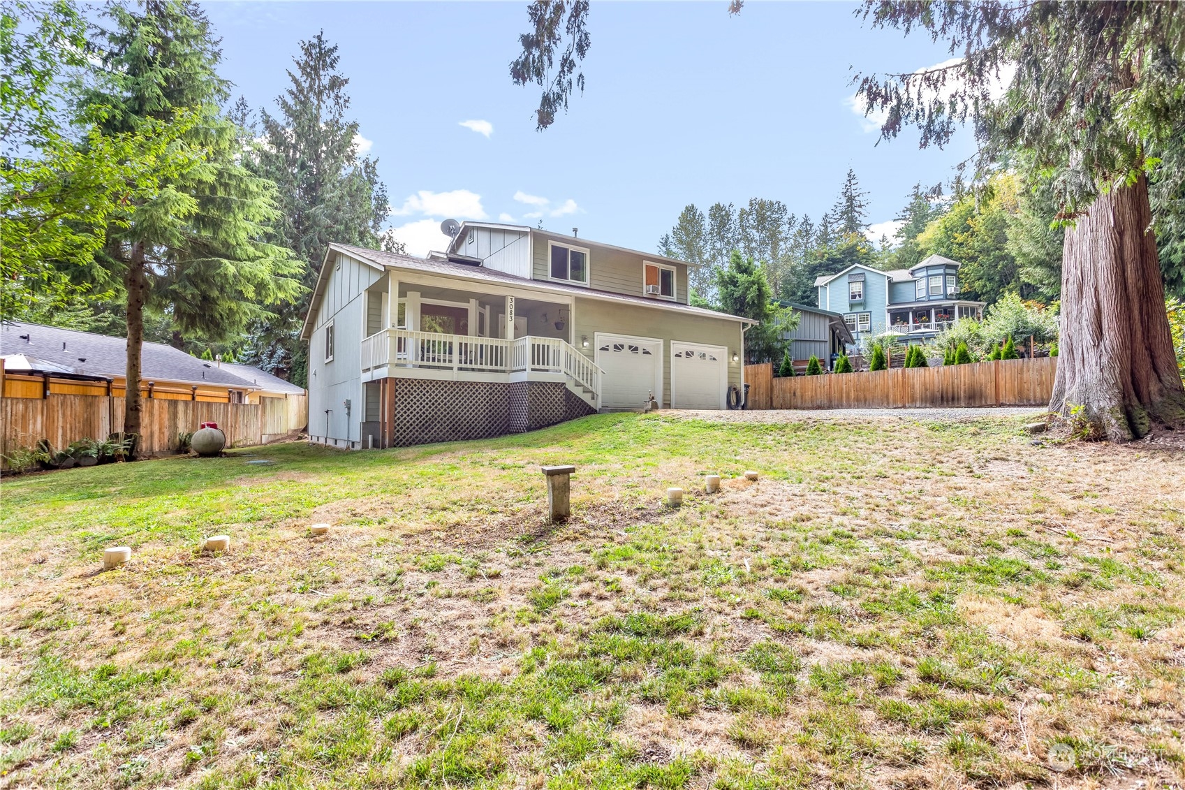 3083 Ash Way Sedro-Woolley, WA 98284 - Photo 2 of 36 a front view of a house with a yard