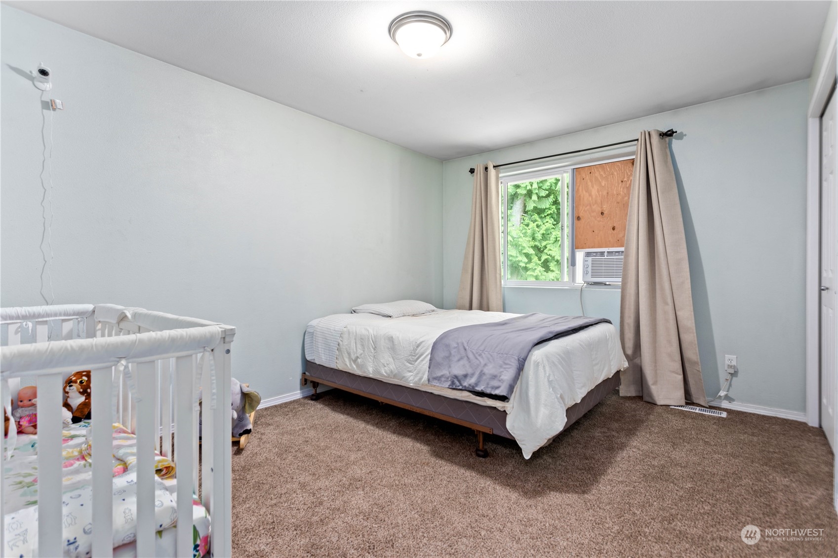 3083 Ash Way Sedro-Woolley, WA 98284 - Photo 23 of 36 a bedroom with a bed and a window