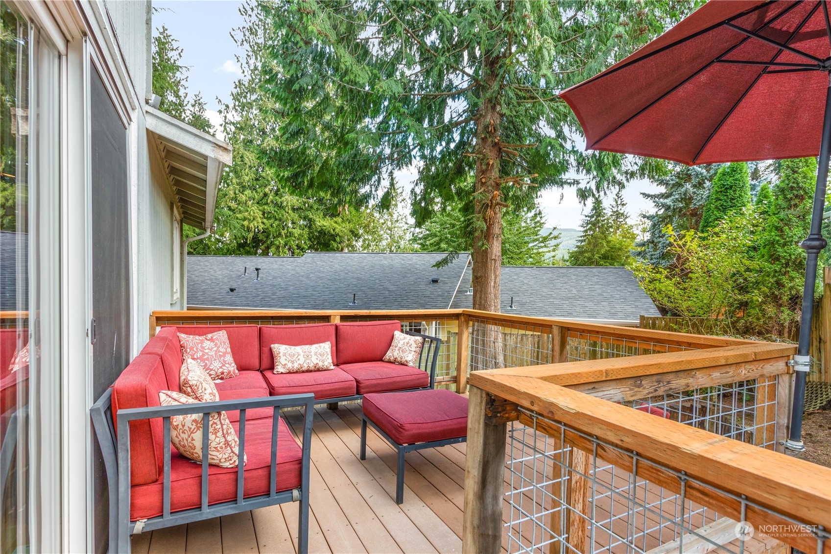 3083 Ash Way Sedro-Woolley, WA 98284 - Photo 26 of 36 a backyard of a house with table and chairs under an umbrella