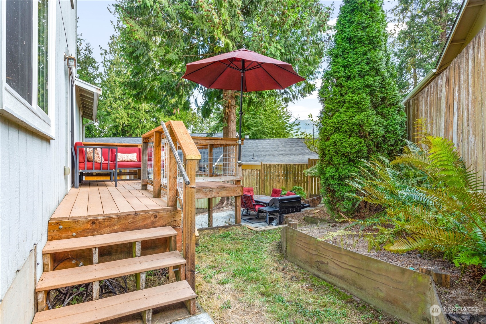 3083 Ash Way Sedro-Woolley, WA 98284 - Photo 27 of 36 a view of house with outdoor seating and city view