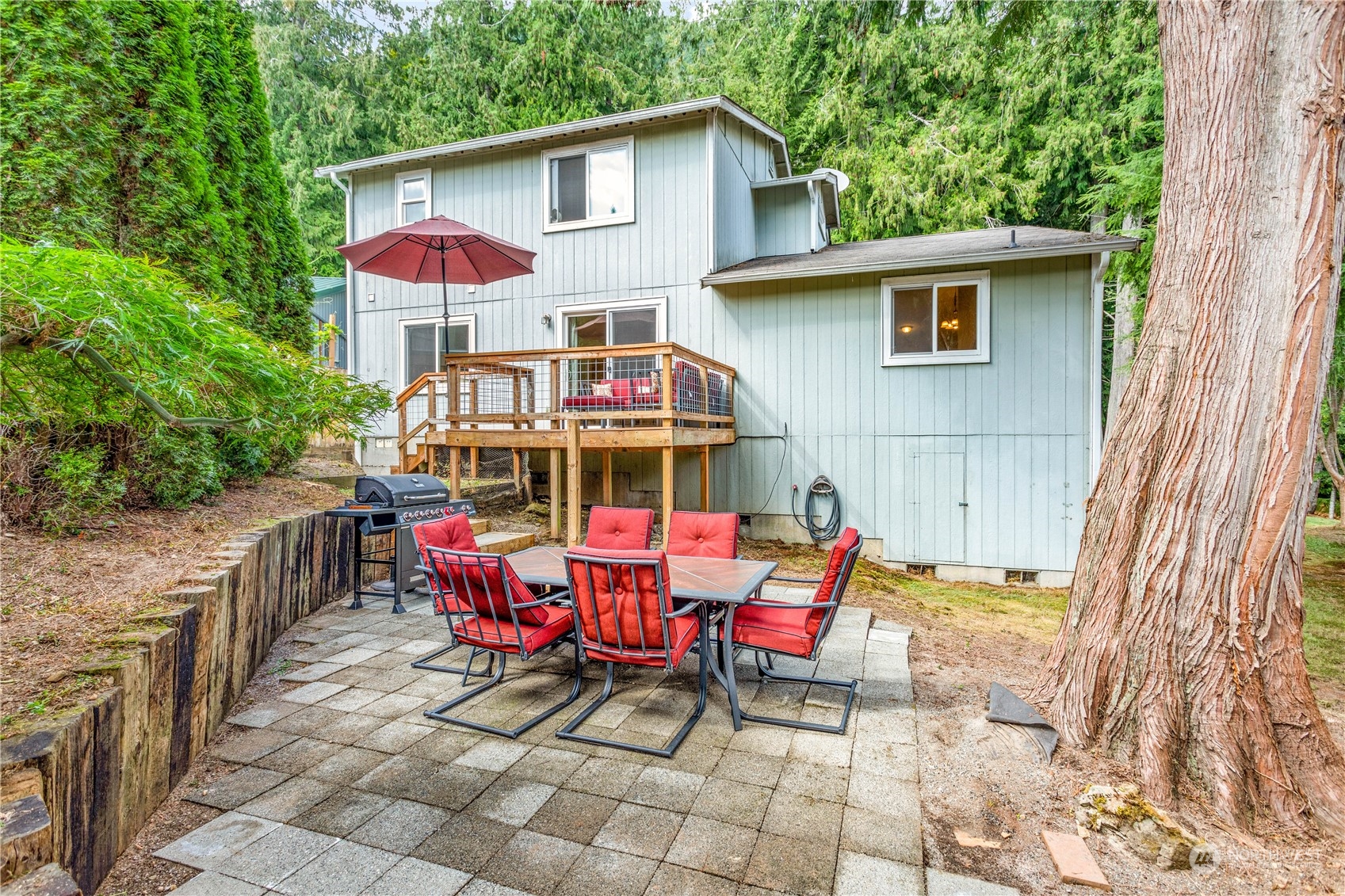3083 Ash Way Sedro-Woolley, WA 98284 - Photo 28 of 36 a view of a chairs and table in the patio in front of the house
