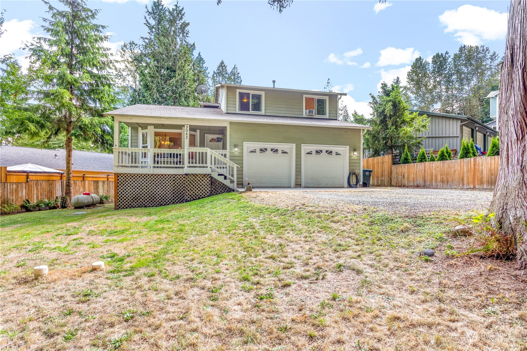 3083 Ash Way Sedro-Woolley, WA 98284 - Photo 30 of 36 a front view of house with yard and trees