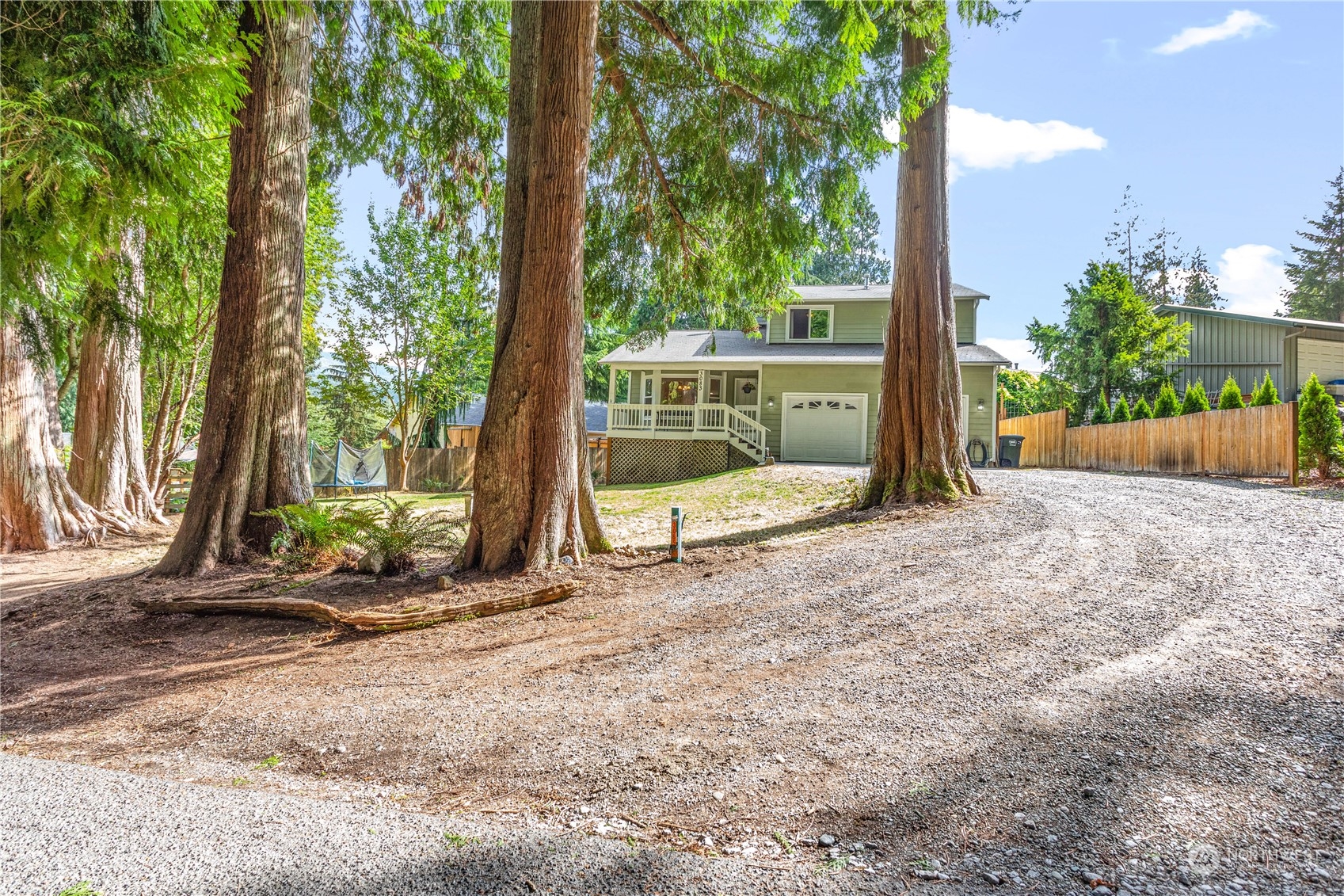 3083 Ash Way Sedro-Woolley, WA 98284 - Photo 3 of 36 a backyard of a house with table and chairs