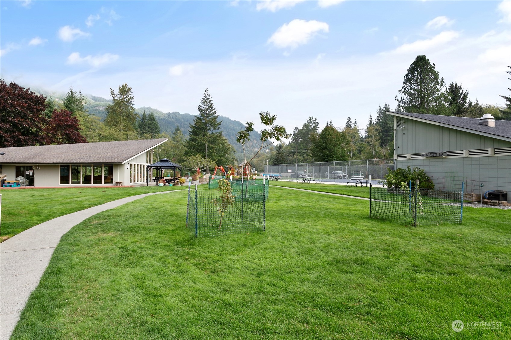 3083 Ash Way Sedro-Woolley, WA 98284 - Photo 33 of 36 a view of a big house with a big yard and a large trees