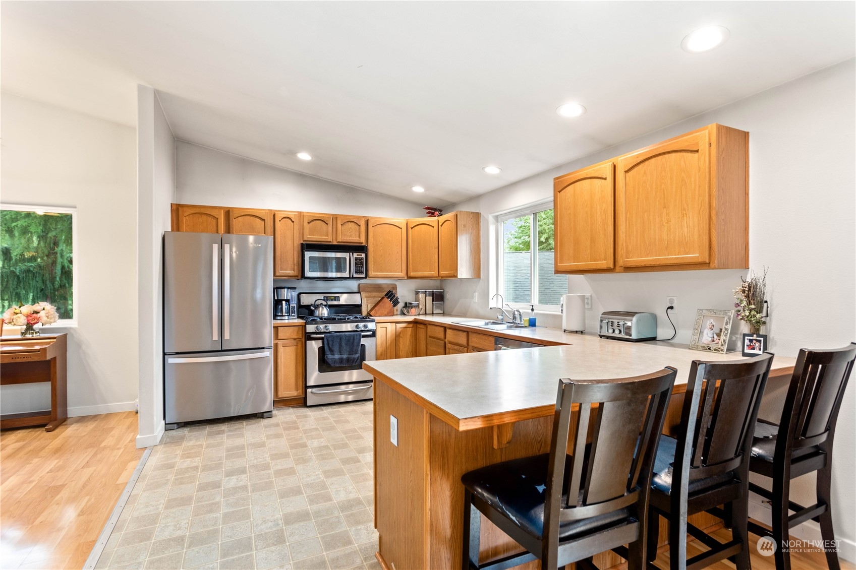 3083 Ash Way Sedro-Woolley, WA 98284 - Photo 10 of 36 a large kitchen with a table and chairs